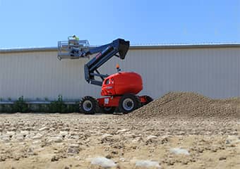 Manitou boom lift working on a construction site