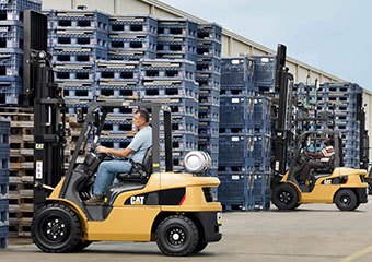 CAT LPG forklifts working in a yard
