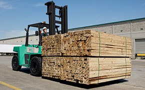 Mitsubishi diesel forklift hauling lumber