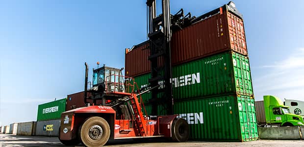 Serviced container handler working at a port