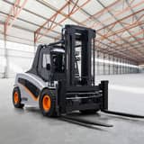 Carer electric forklift in a warehouse