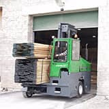 Combilift C-Series moving lumber through a door