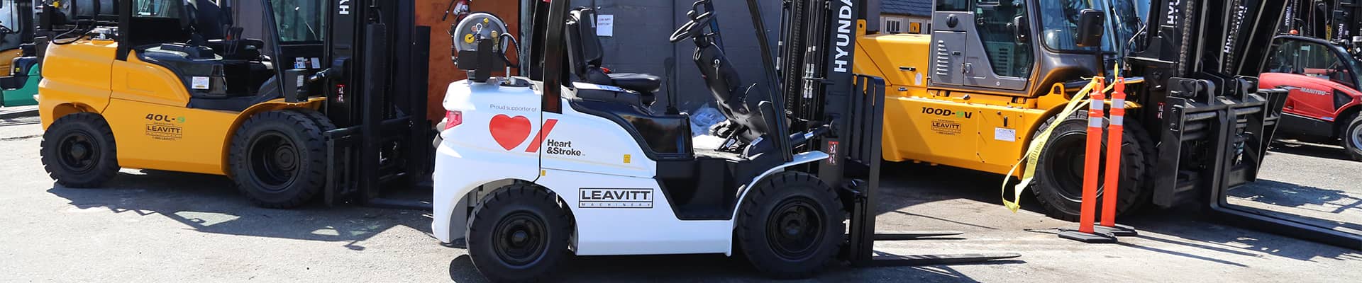Forklift with Leavitt Machinery and the Heart & Stroke Foundation Logos