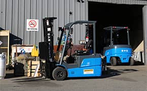 Electric forklift rental working in a warehouse