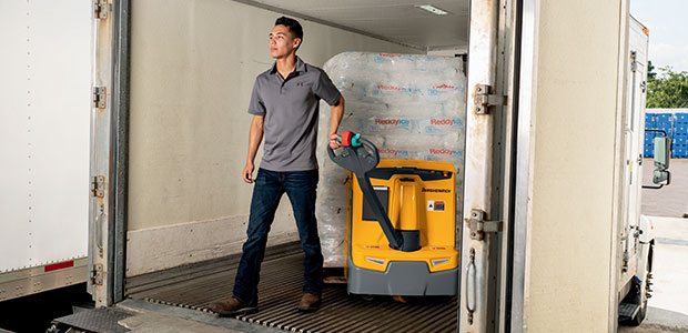 Operator training of an electric pallet jack unloading goods from a truck