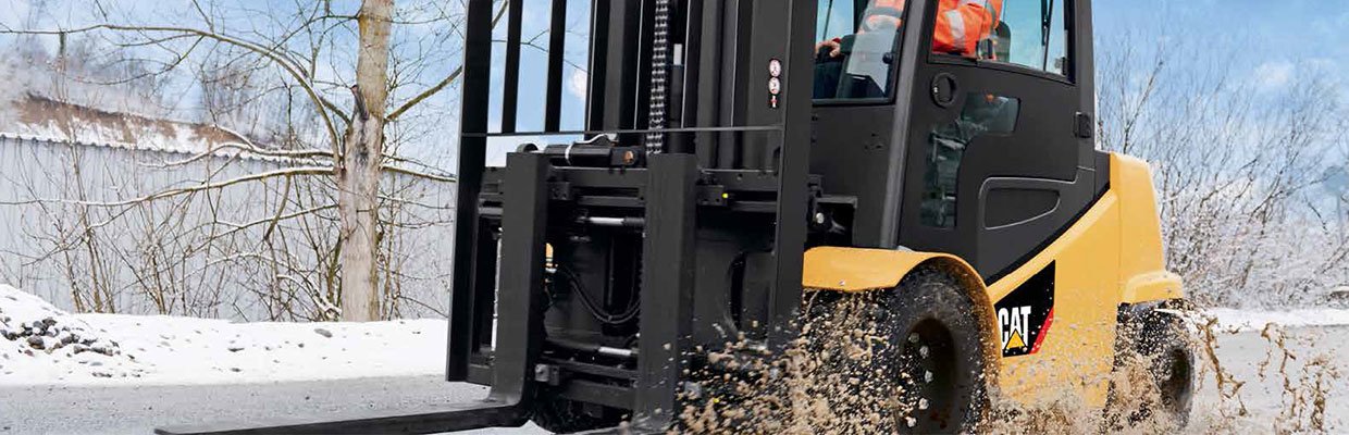 Forklift driving through snow