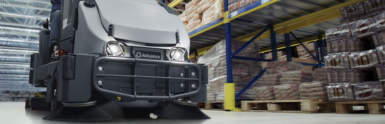 Sweeper cleaning the inside of a warehouse