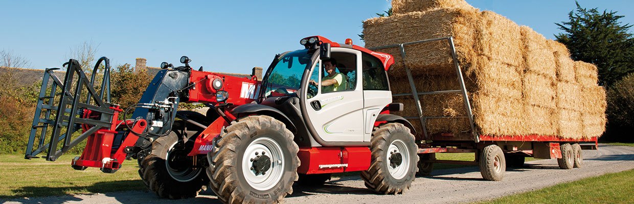 Manitou machinery pulling hay