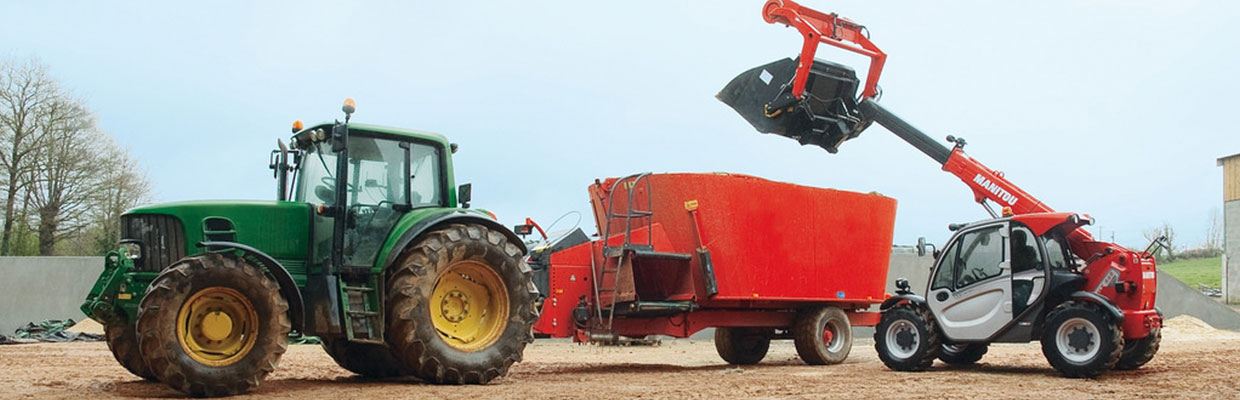 Manitou working with a tractor