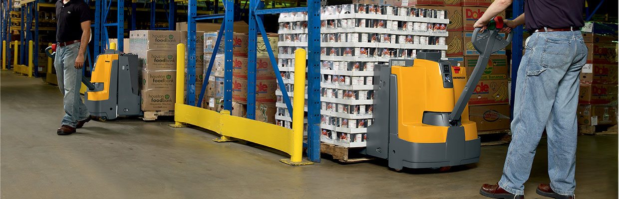 Electric pallet jacks working in a warehouse