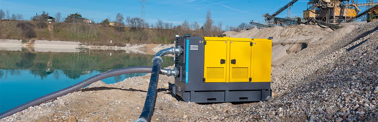 Atlas Copco pump being used at a lake