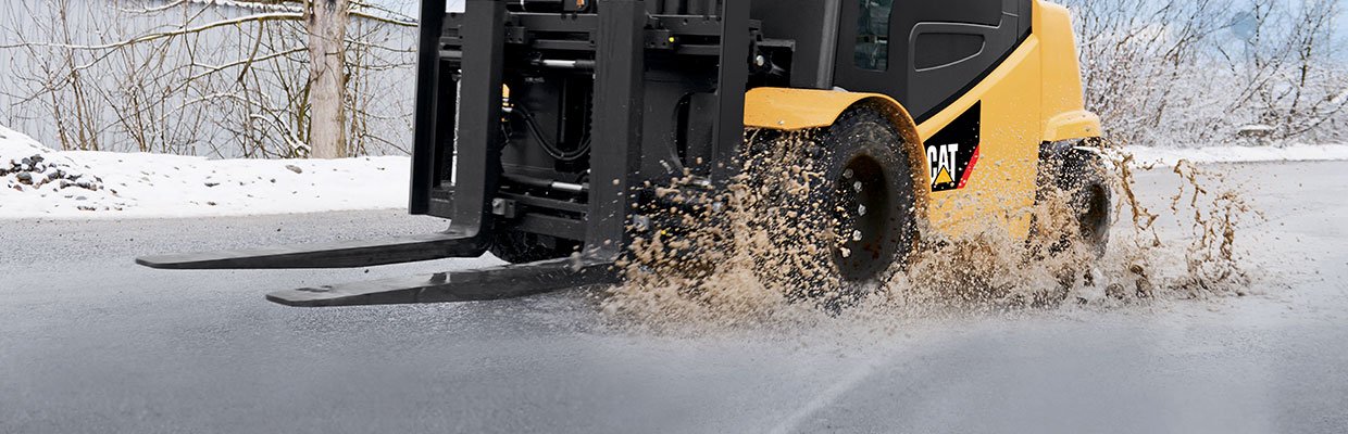 CAT forklift operating in the snow