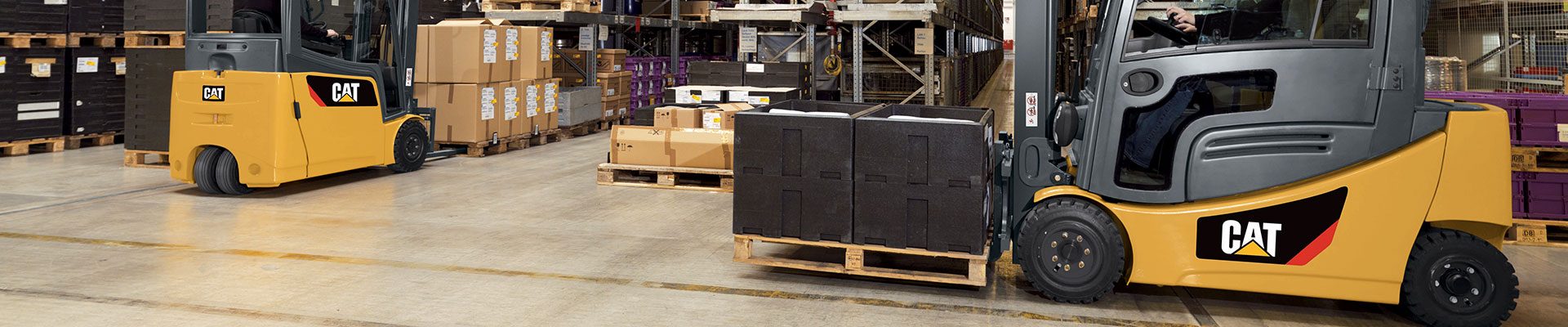 Fleet of CAT forklifts working in a warehouse