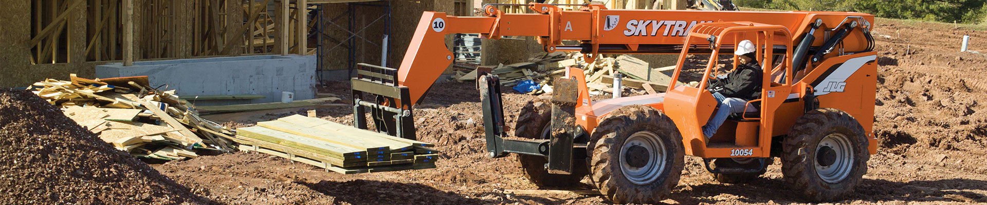 SkyTrak telehandlers  lifting wood on a construction site