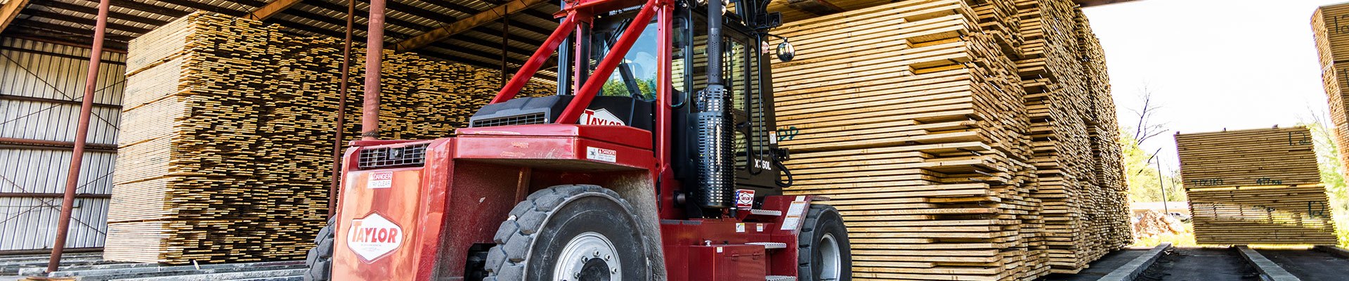 Taylor forklift in a forestry application hauling lumber