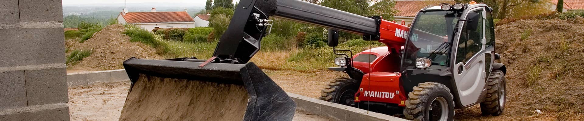 Telehandler lifting concrete blocks