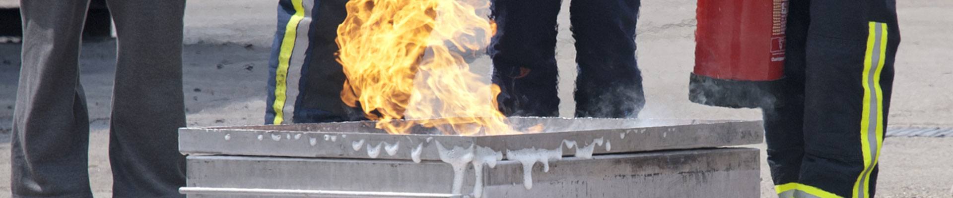 Flammable liquid on fire being put out for safety