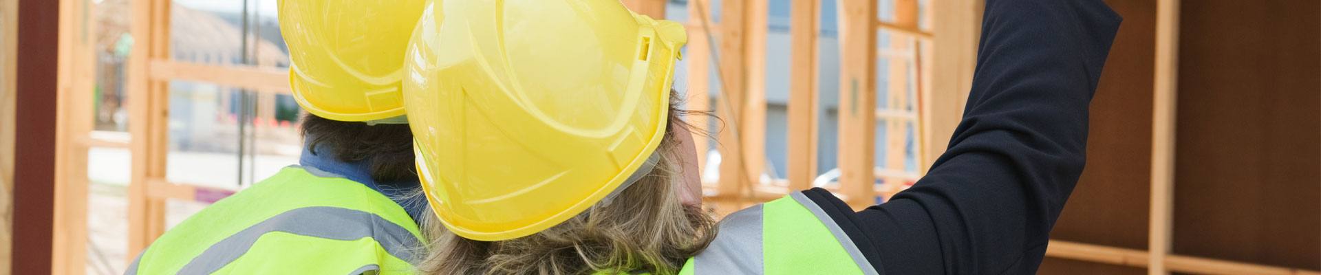 Two people doing hazard assessment training on a construction site