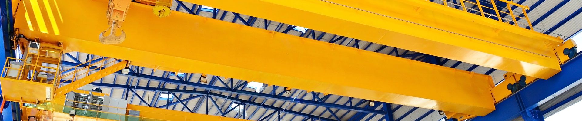 Yellow overhead cranes used for training