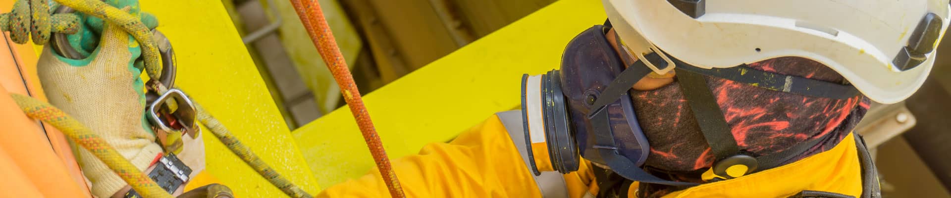 Worker wearing respirator protective equipment