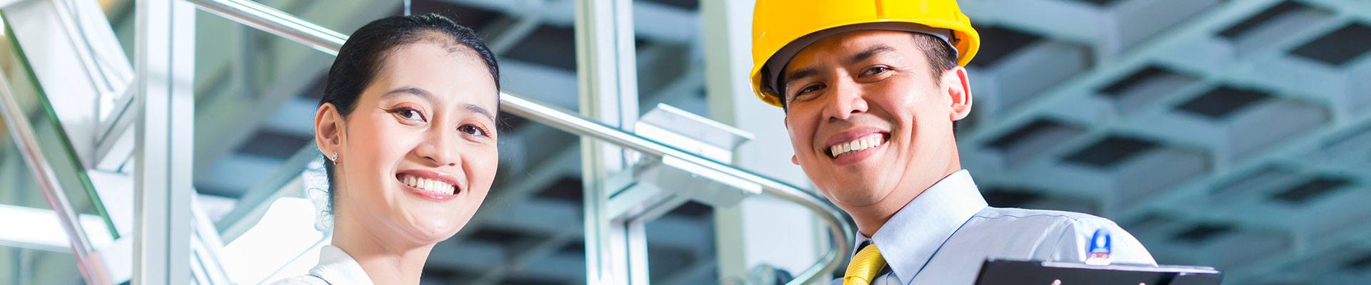 Sales women standing next top a construction executive