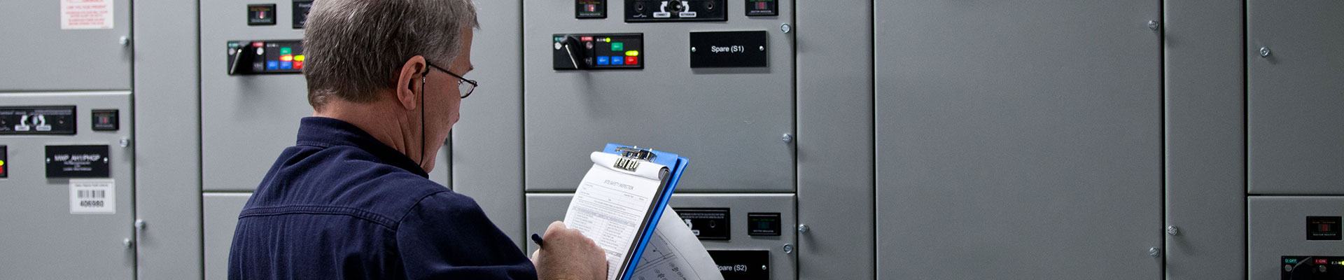 Worker with an electrical checklist