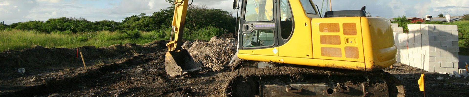 Operator working an excavator on a construction site