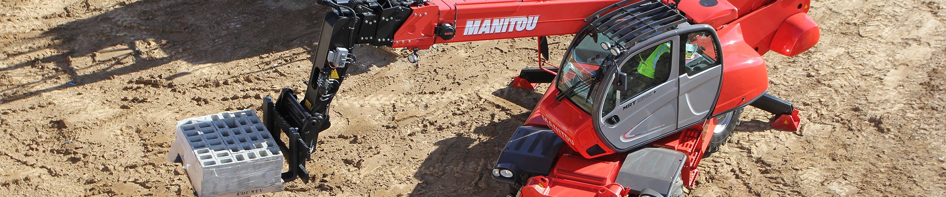 Operator training done on a Manitou rotating telehandler at a construction site