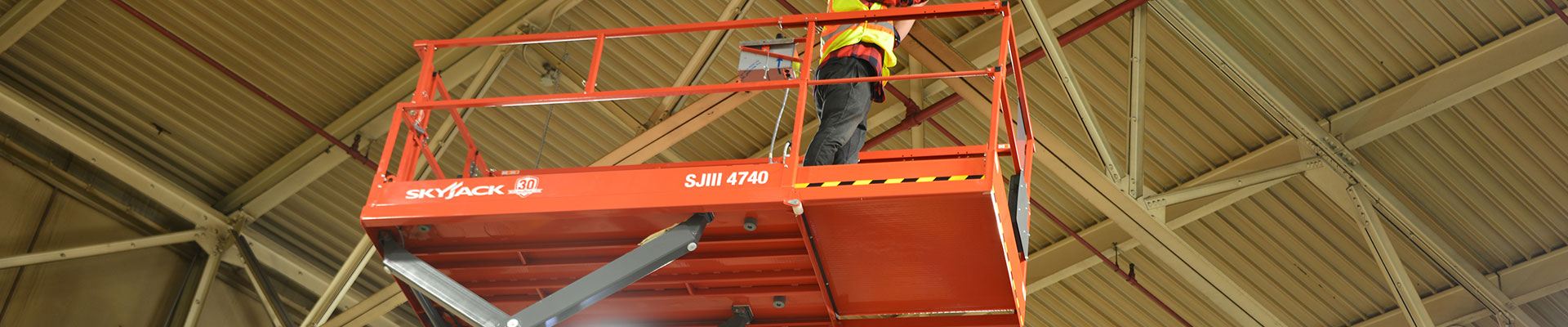 Parts for a Skyjack scissor lift working construction