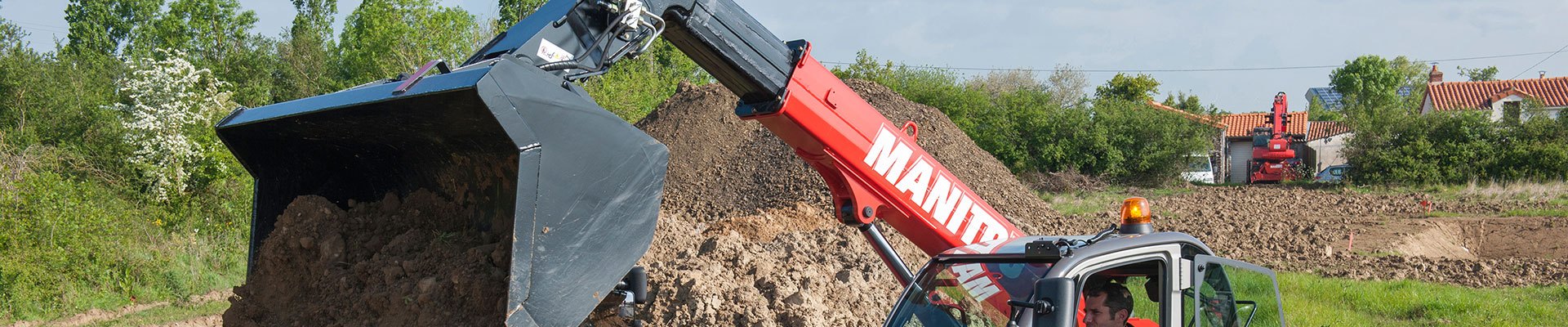 Telehandler with an attachment working