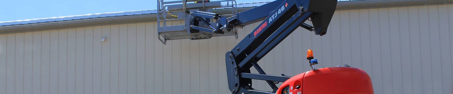 Articulating boom lift rental working in construction