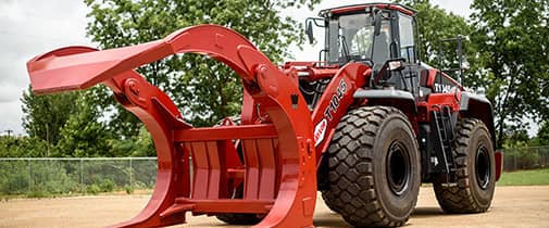 Taylor wheel loader with a log grapple attachment