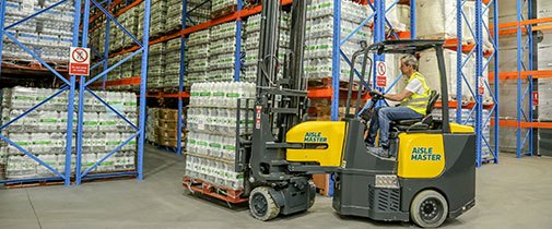 Aisle Master forklifts driving in a warehouse