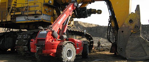 Manitou MHT telehandlers working on a mining hauler