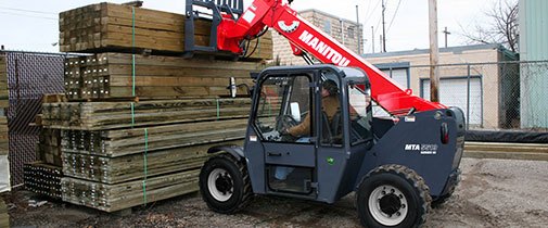 Manitou telehandlers hauling lumber