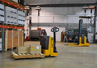 Big Joe Pallet Jack moving a box on a pallet