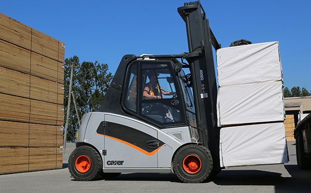 Carer A100 electric forklift hauling lumber