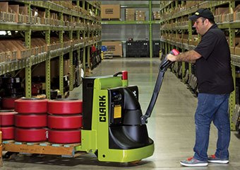 Clark pallet jack being used in a warehouse