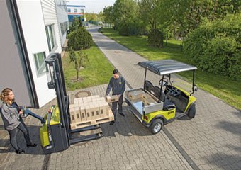 Clark walkie stackers loading a cart