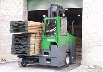 Combilift sideloader hauling lumber