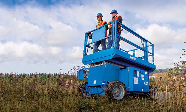 Genie scissor lift carrying two operators