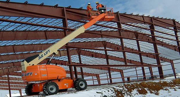 JLG boom lift working on a building
