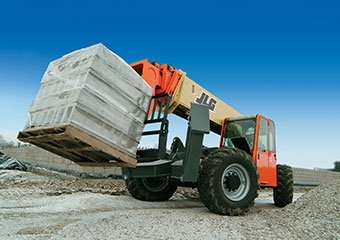 JLG telehandler hauling concrete blocks