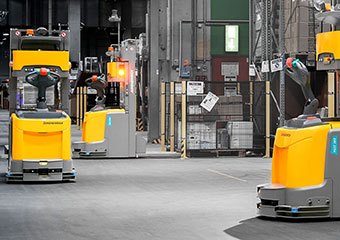 Jungheinrich automated guided vehicles being used in a warehouse