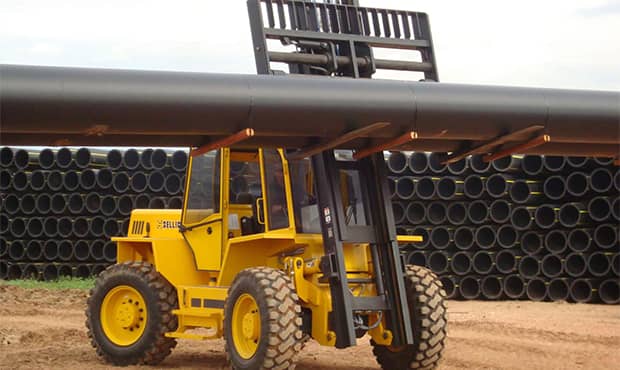 Sellick rough terrain forklifts lifting pipes