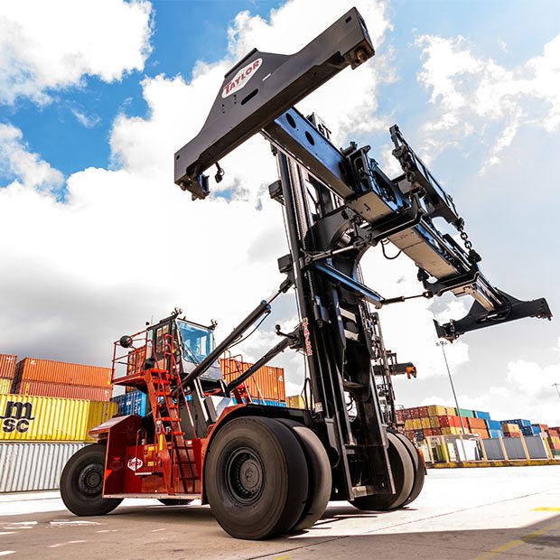 Taylor container handler in front of containers