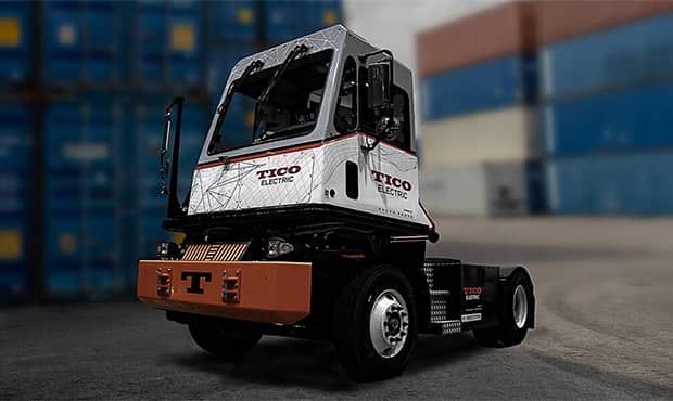 A TICO electric terminal tractor in a shipping yard