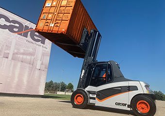 Carer forklift hauling a container