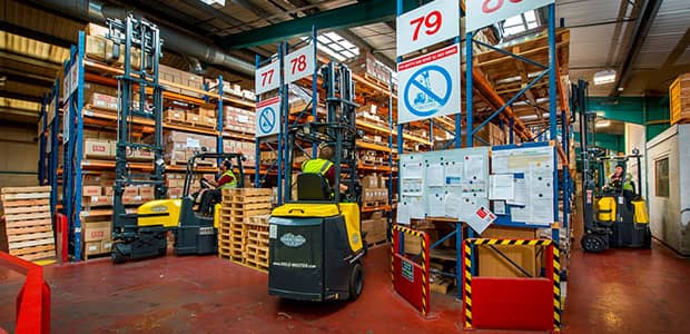 Narrow aisle forklifts working in a warehouse