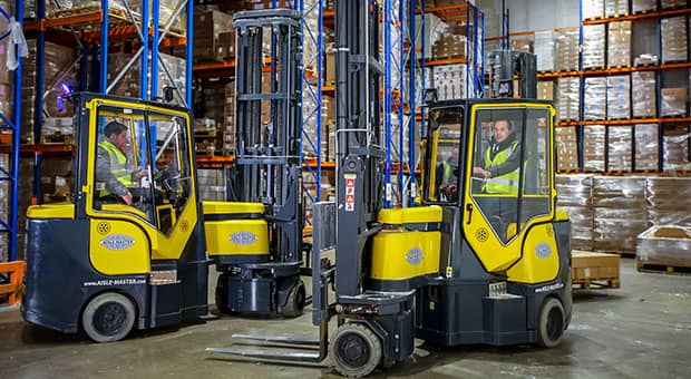 Aisle Master narrow aisle forklifts working in a warehouse